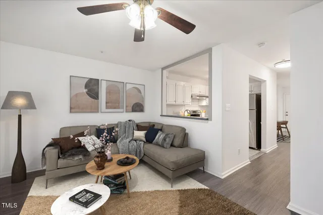 a living room with furniture and a lamp