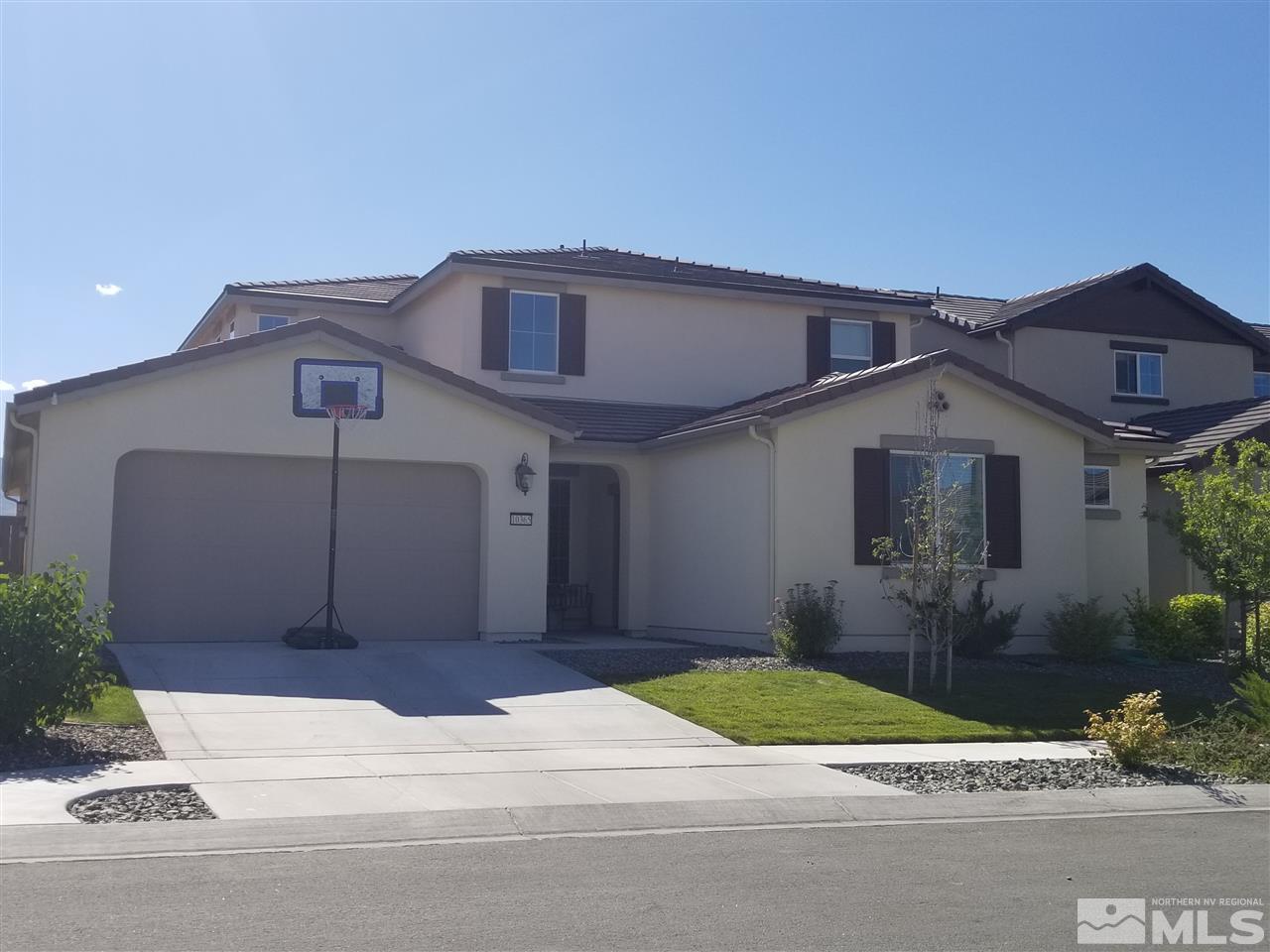 10365 Mott Drive Reno, NV 89521 - Photo 1 of 1 a front view of a house with a yard and garage