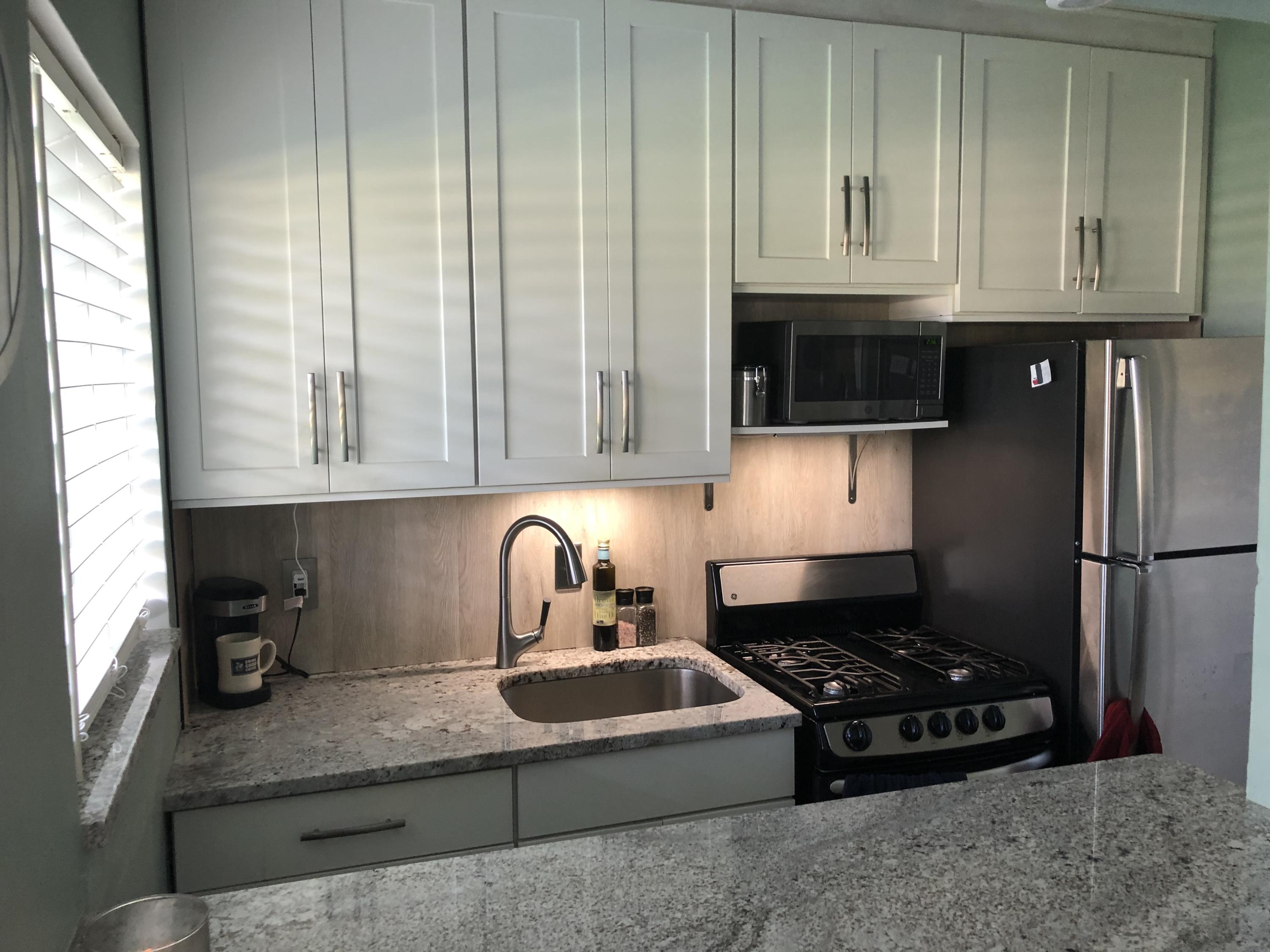 1006 Casuarina Road, Unit 5 Delray Beach, FL 33483 - Photo 5 of 18 New wood cabinets, silent close.