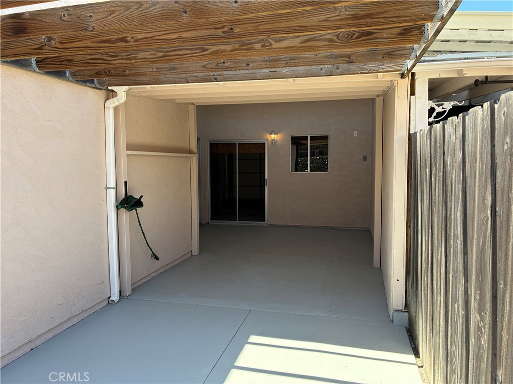 517 Queenanne Road Paso Robles, CA 93446 - Photo 12 of 18 Open beam cover at the yard side of the patio meets the ample enclosed area going into the home and garage patio doors.