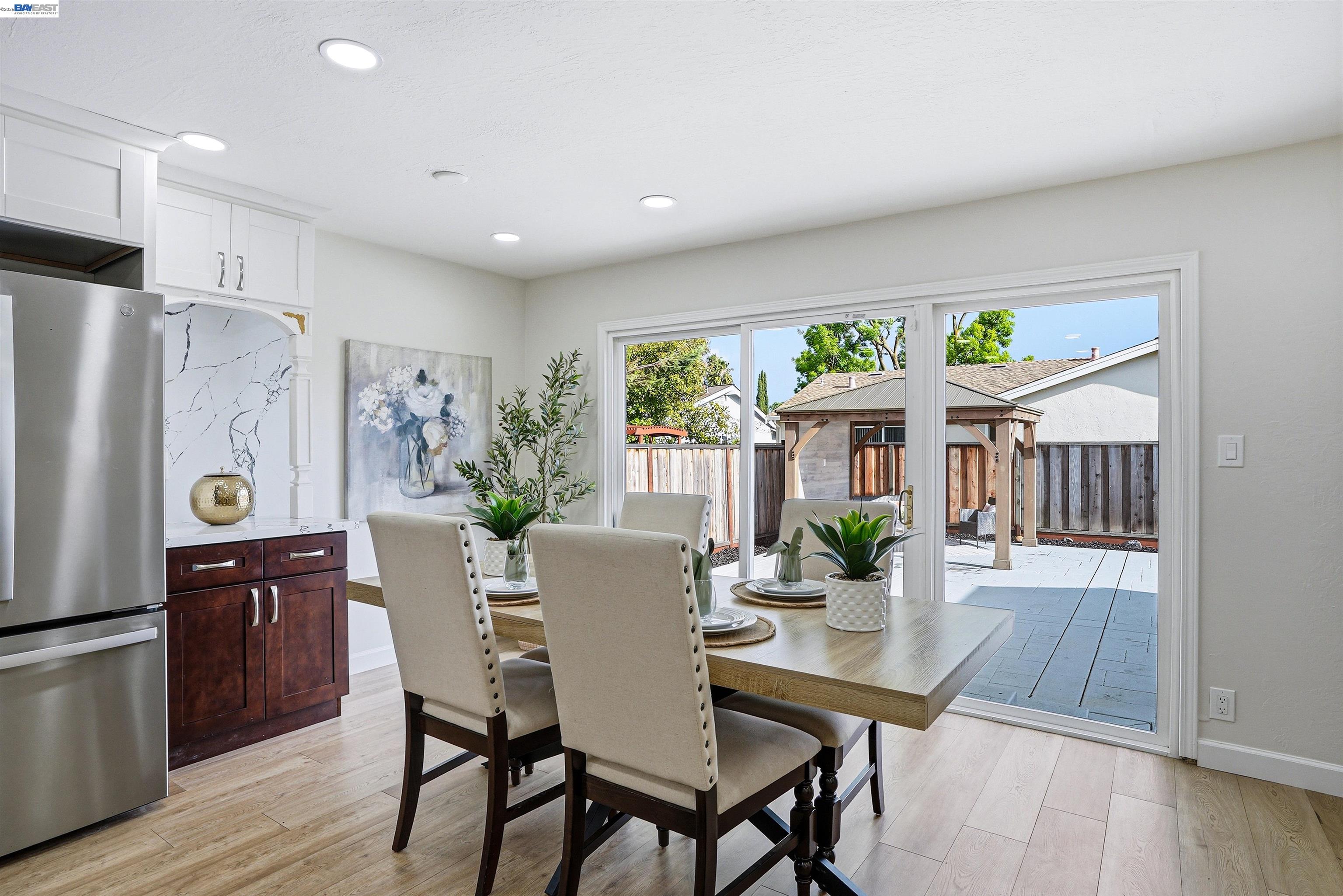 6738 Rancho Court Pleasanton, CA 94588 - Photo 11 of 33 a view of a dining room with furniture window and wooden floor