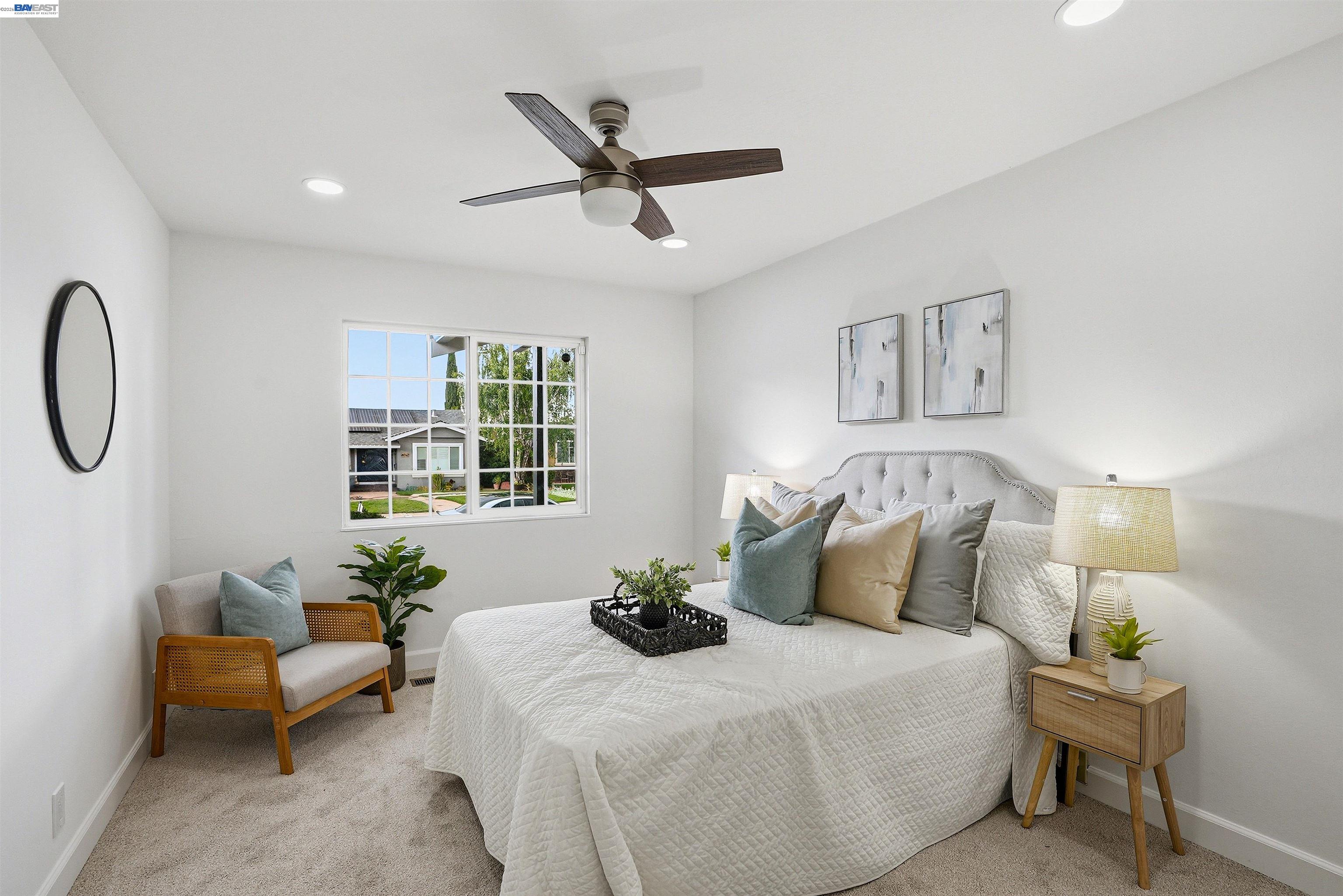 6738 Rancho Court Pleasanton, CA 94588 - Photo 17 of 33 a bedroom with a bed mirror and window