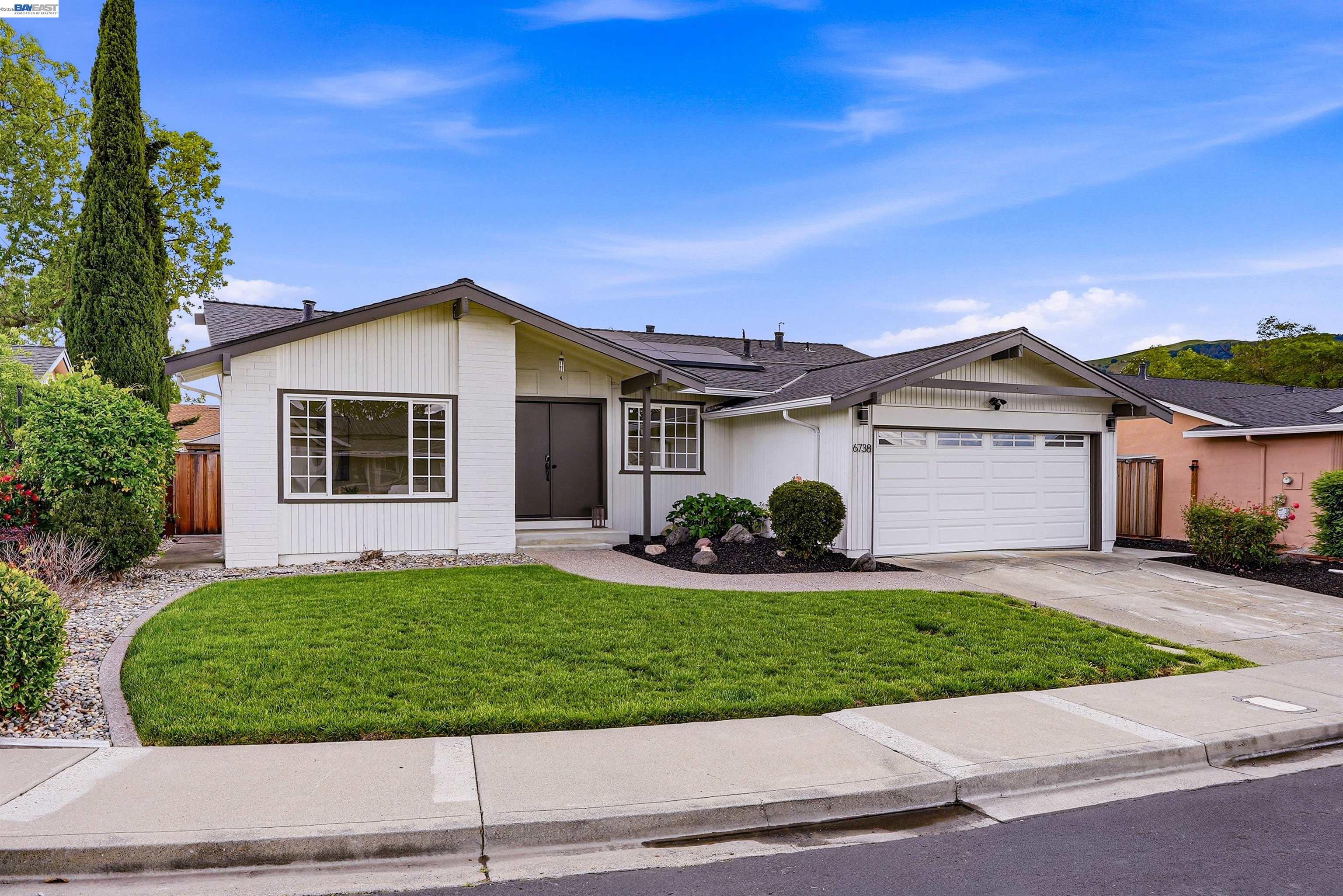 6738 Rancho Court Pleasanton, CA 94588 - Photo 2 of 33 a front view of a house with a yard and garage