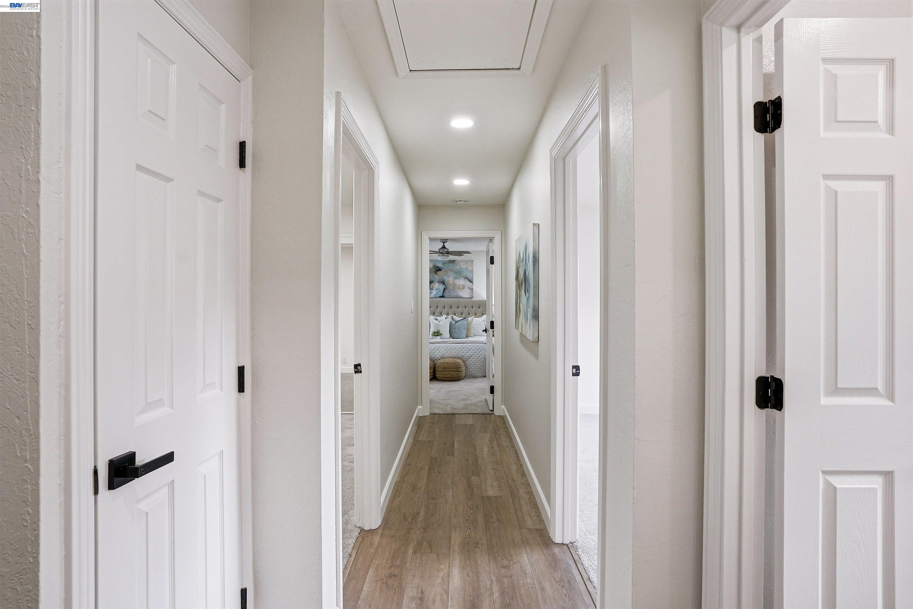 6738 Rancho Court Pleasanton, CA 94588 - Photo 23 of 33 a view of a hallway with wooden floor and closet area
