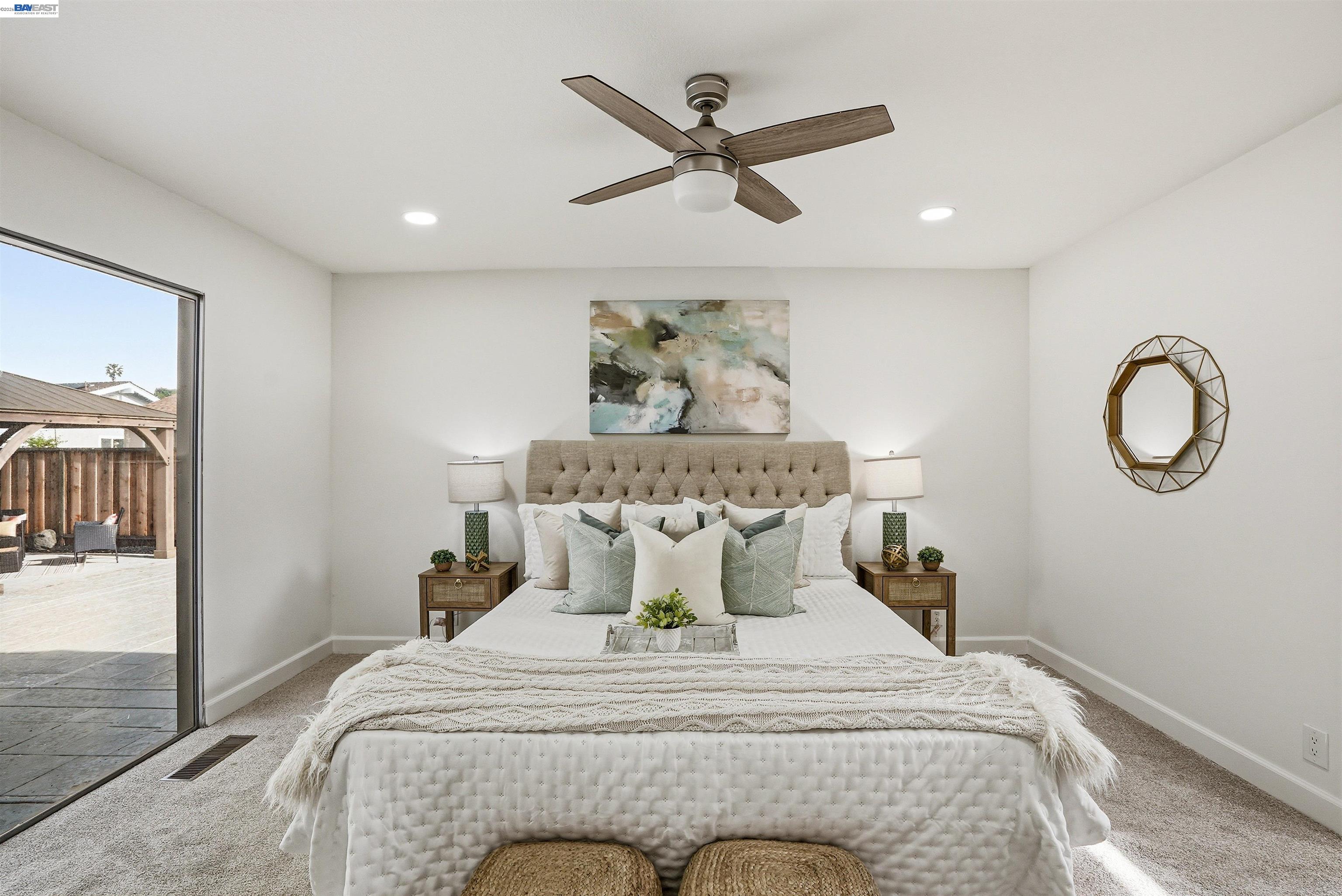 6738 Rancho Court Pleasanton, CA 94588 - Photo 24 of 33 a bed sitting in a room next to a window