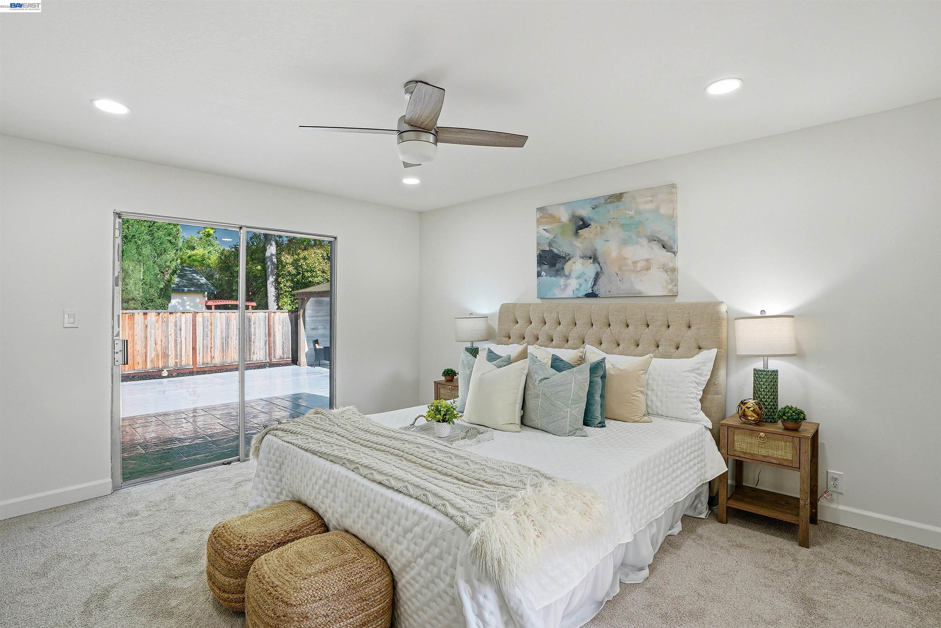 6738 Rancho Court Pleasanton, CA 94588 - Photo 25 of 33 a bedroom with a large bed and a large window