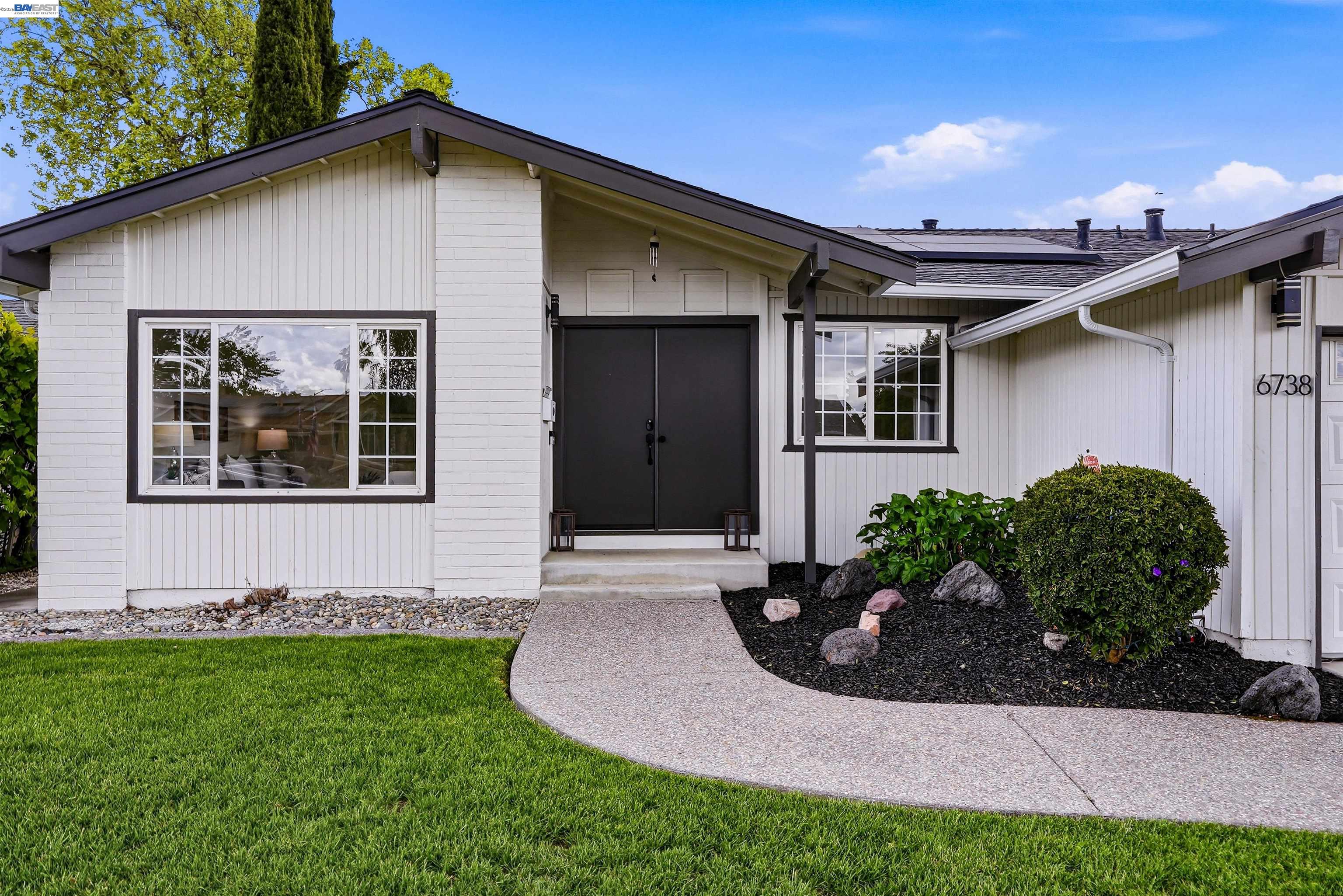 6738 Rancho Court Pleasanton, CA 94588 - Photo 3 of 33 a front view of a house with garden