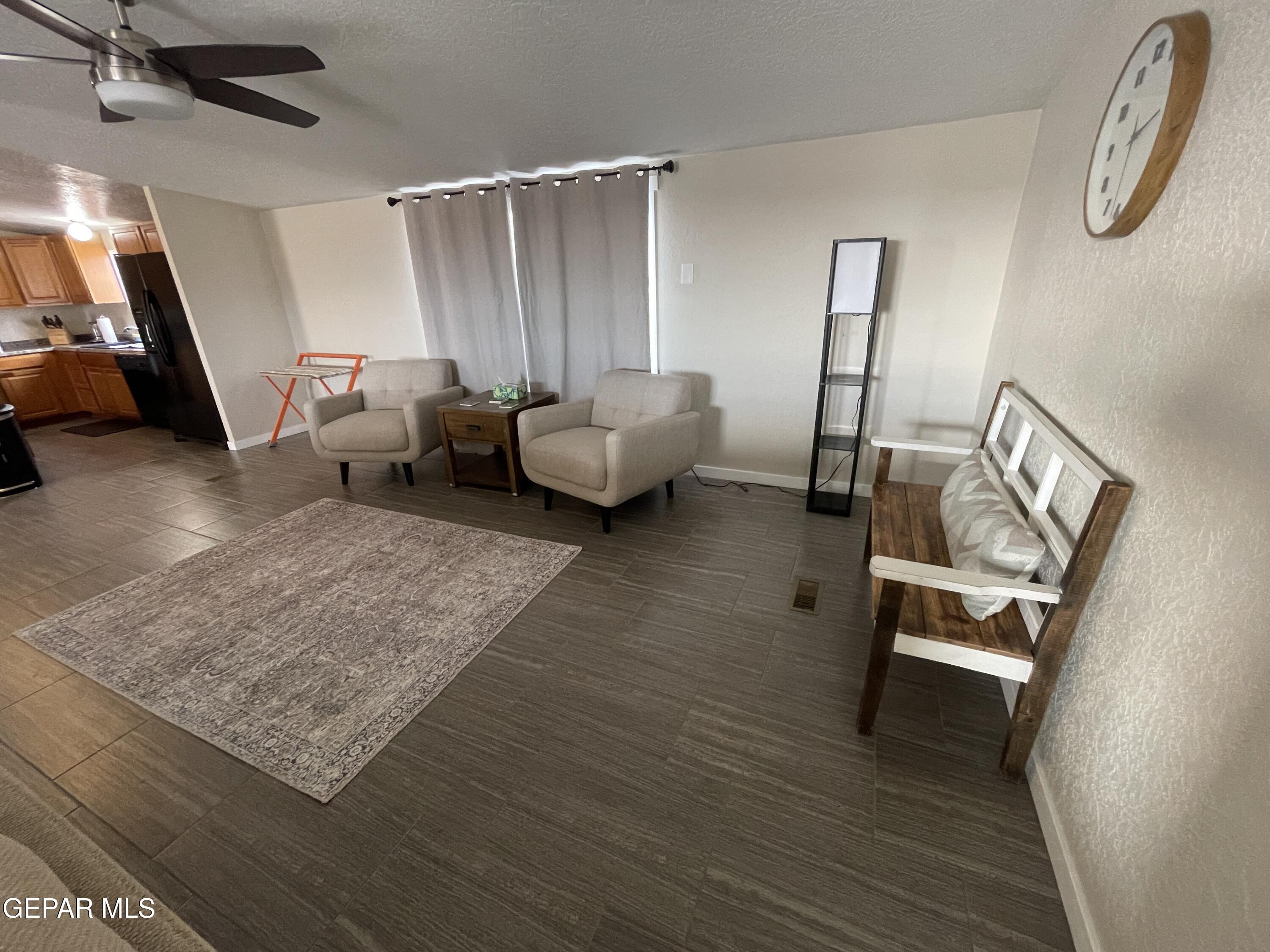 2901 Cook Street Truth Or Consequences, NM 87901 - Photo 9 of 28 a living room with furniture and a wooden floor