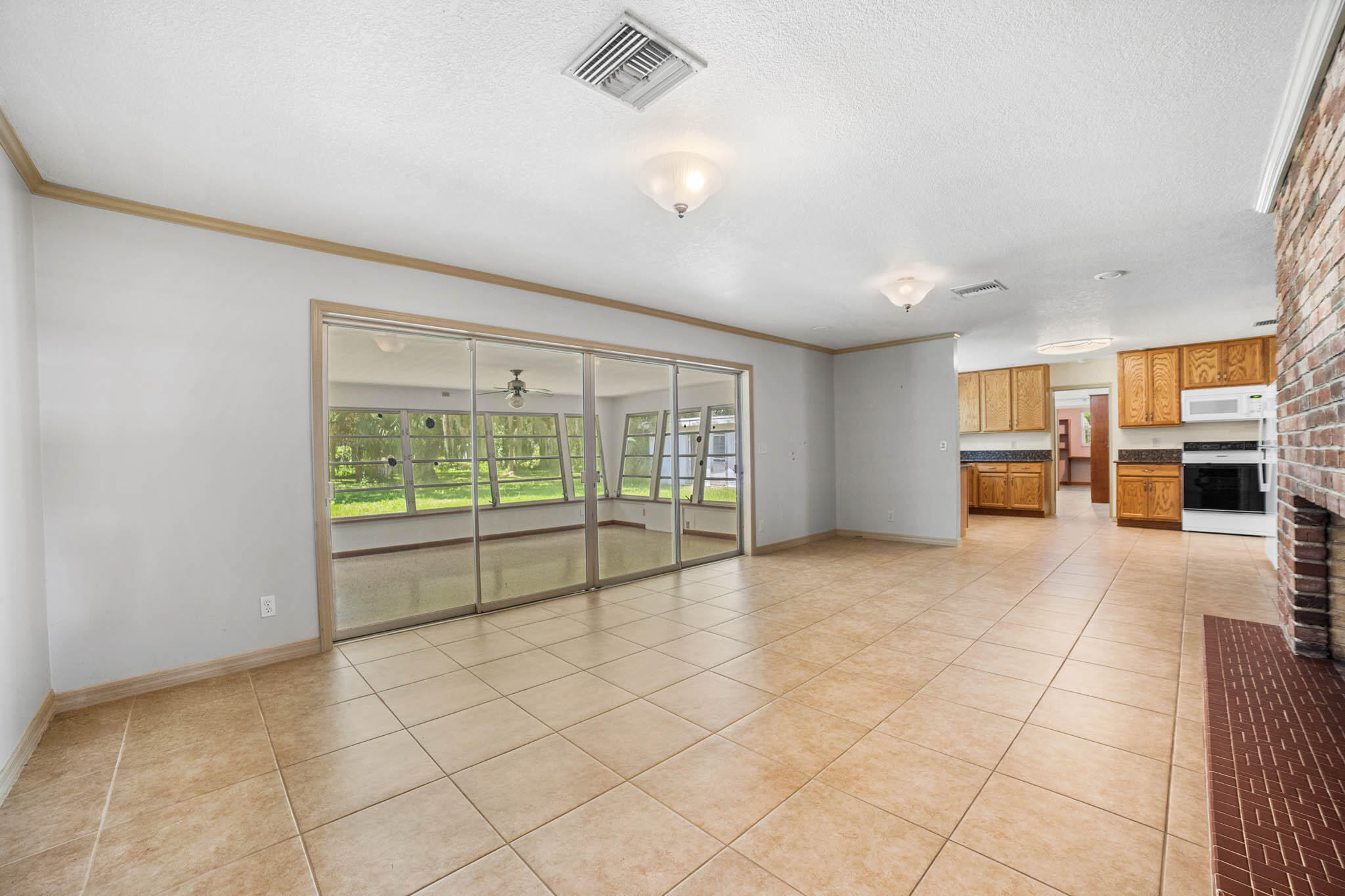409 Southwest 15th Street Okeechobee, FL 34974 - Photo 6 of 14 a view of an empty room with a window