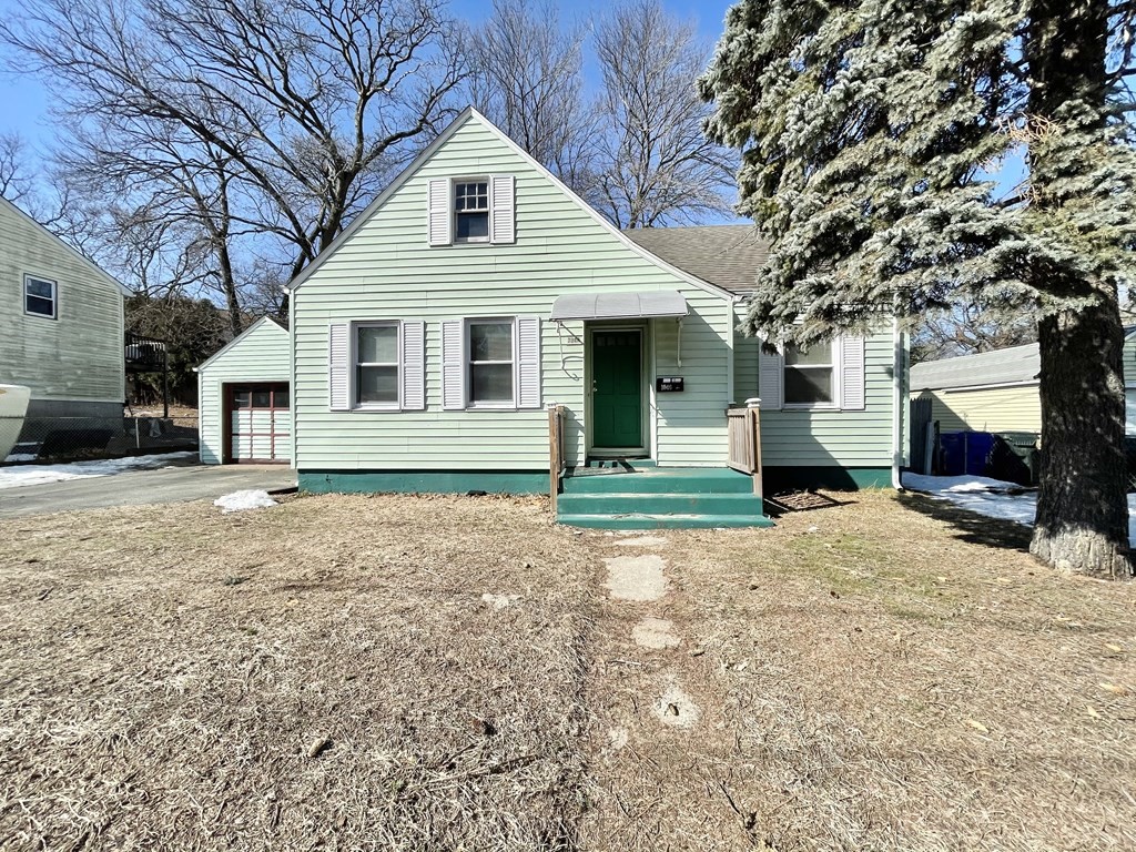 1046 Liberty Street Springfield, MA 01104 - Photo 1 of 19 a front view of a house with a yard
