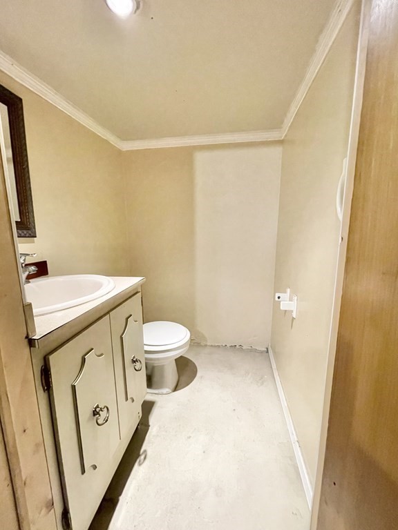 1046 Liberty Street Springfield, MA 01104 - Photo 13 of 19 a bathroom with a sink a toilet and a mirror
