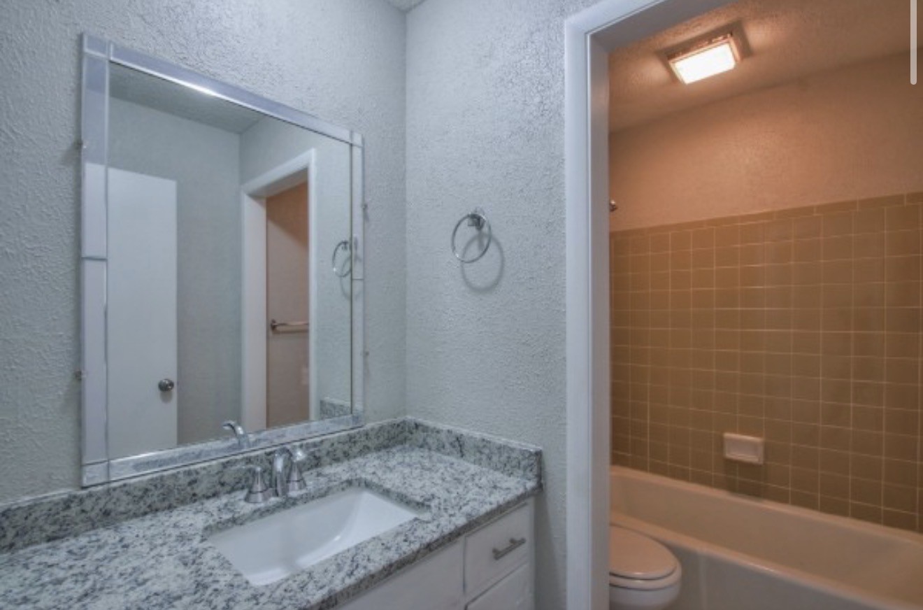 2116 Hobbs Road, Unit M5 Nashville, TN 37215 - Photo 13 of 18 a bathroom with a granite countertop sink toilet and shower