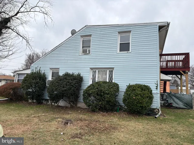 a view of a house with a yard and plants