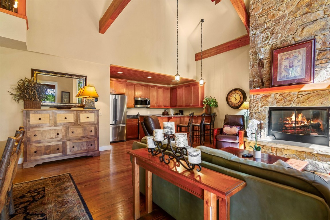 55 Westridge Road, Unit 55 Breckenridge, CO 80424 - Photo 15 of 42 a room with lots of wooden furniture and a tv