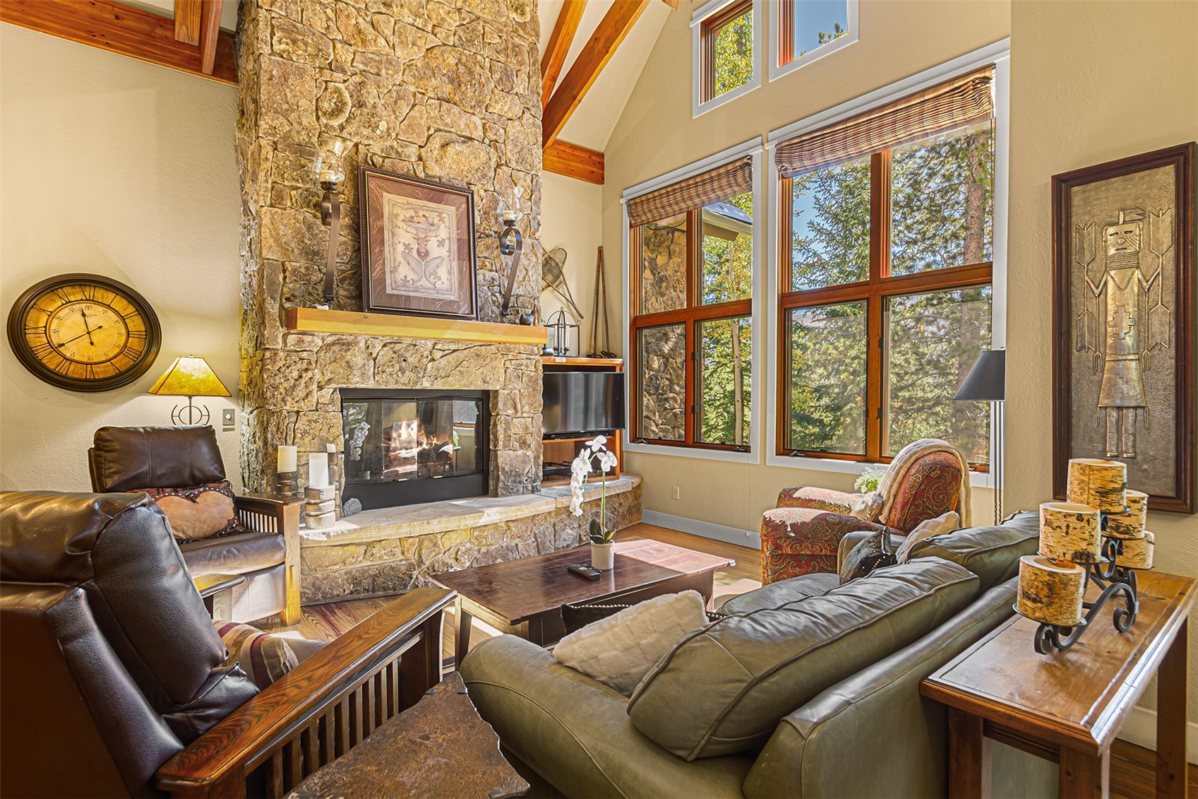 55 Westridge Road, Unit 55 Breckenridge, CO 80424 - Photo 2 of 42 a living room with furniture a fireplace and a large window