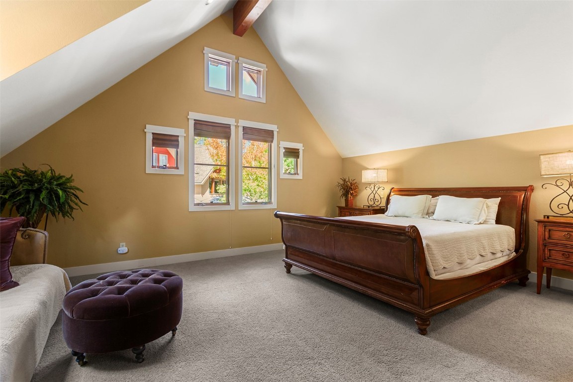 55 Westridge Road, Unit 55 Breckenridge, CO 80424 - Photo 22 of 42 a bedroom with a bed and a window