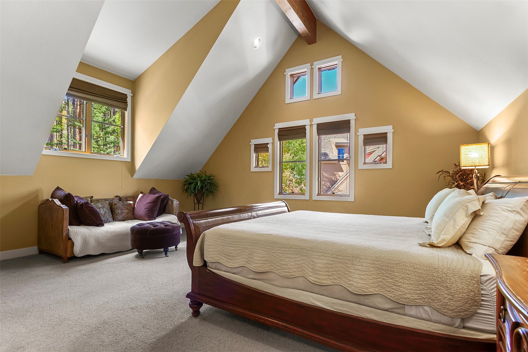 55 Westridge Road, Unit 55 Breckenridge, CO 80424 - Photo 23 of 42 a bedroom with a bed and wooden floor