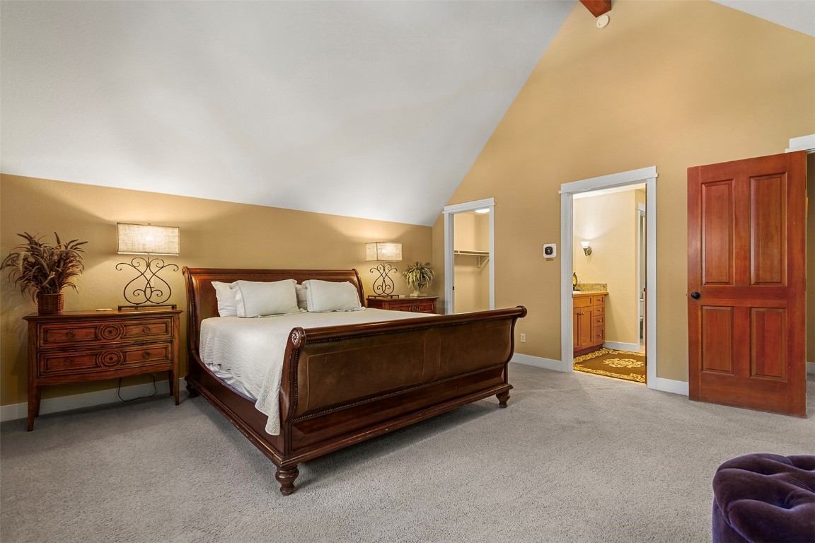 55 Westridge Road, Unit 55 Breckenridge, CO 80424 - Photo 24 of 42 a spacious bedroom with a bed and a cabinets