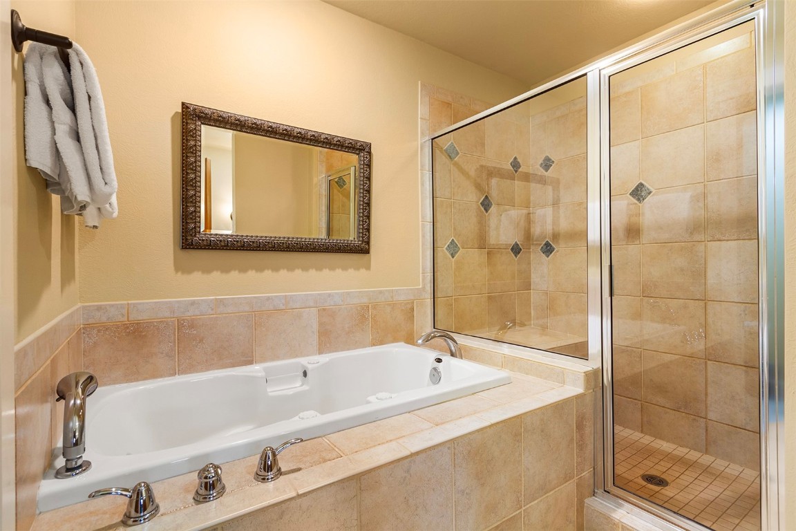55 Westridge Road, Unit 55 Breckenridge, CO 80424 - Photo 26 of 42 a bathroom with a tub and a shower