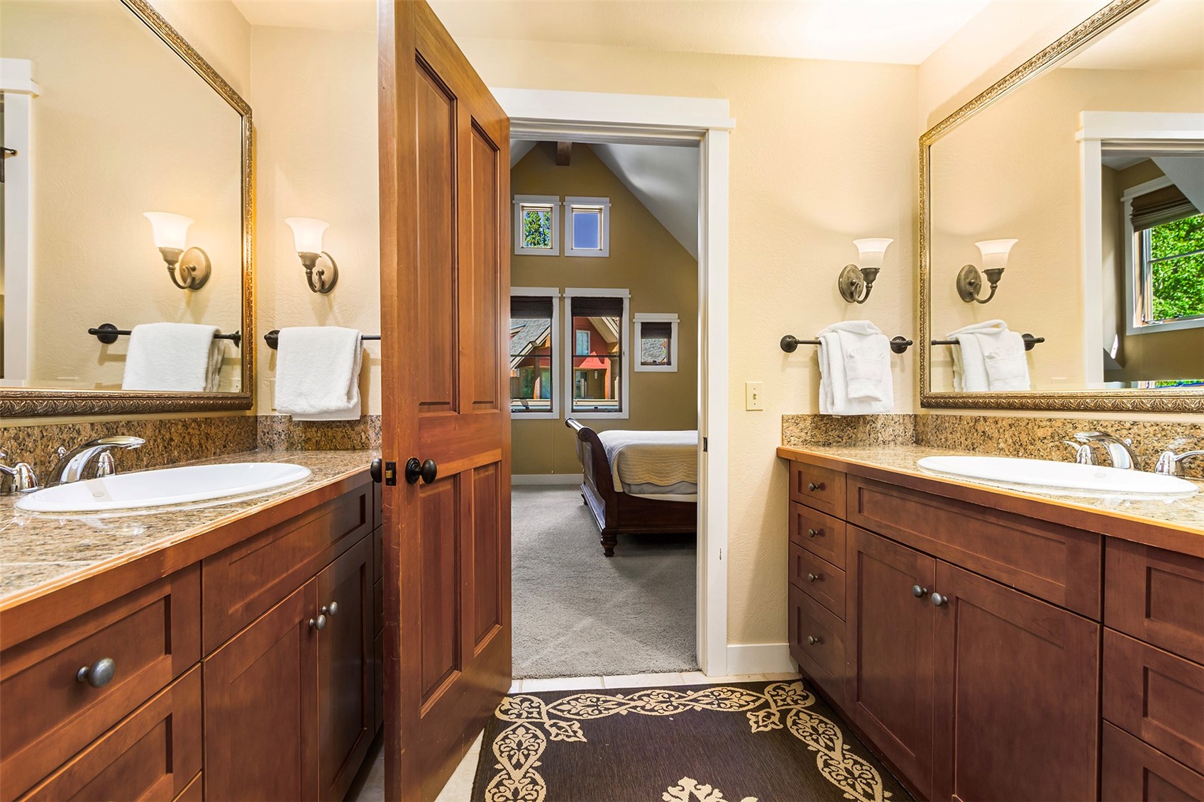 55 Westridge Road, Unit 55 Breckenridge, CO 80424 - Photo 27 of 42 a spacious bathroom with a double vanity sink a mirror and a shower