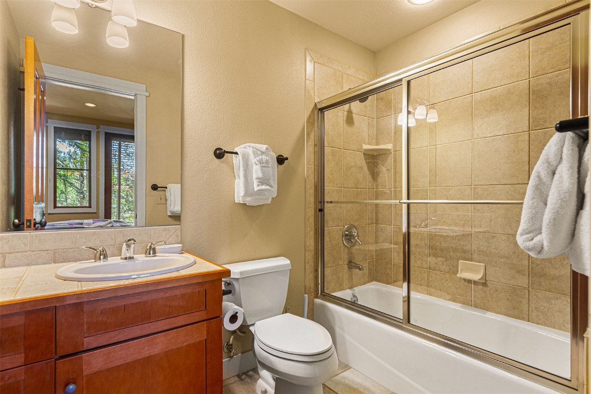 55 Westridge Road, Unit 55 Breckenridge, CO 80424 - Photo 31 of 42 a bathroom with a sink a toilet and shower