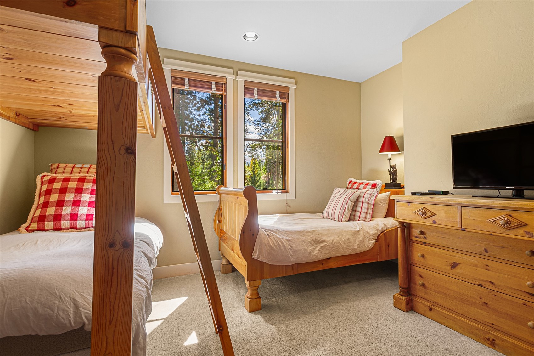 55 Westridge Road, Unit 55 Breckenridge, CO 80424 - Photo 33 of 42 a bedroom with a bed and flat screen tv