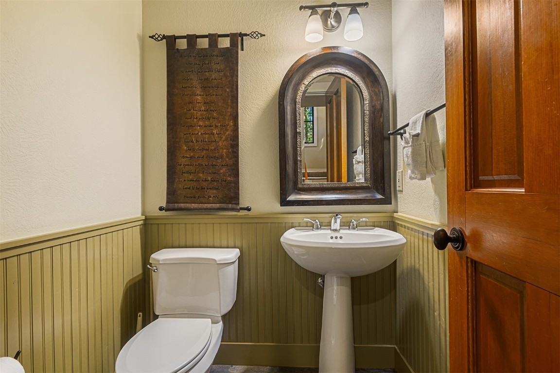 55 Westridge Road, Unit 55 Breckenridge, CO 80424 - Photo 37 of 42 a bathroom with a sink a mirror and a toilet