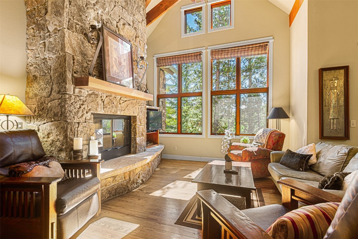 55 Westridge Road, Unit 55 Breckenridge, CO 80424 - Photo 6 of 42 a living room with furniture and a fireplace