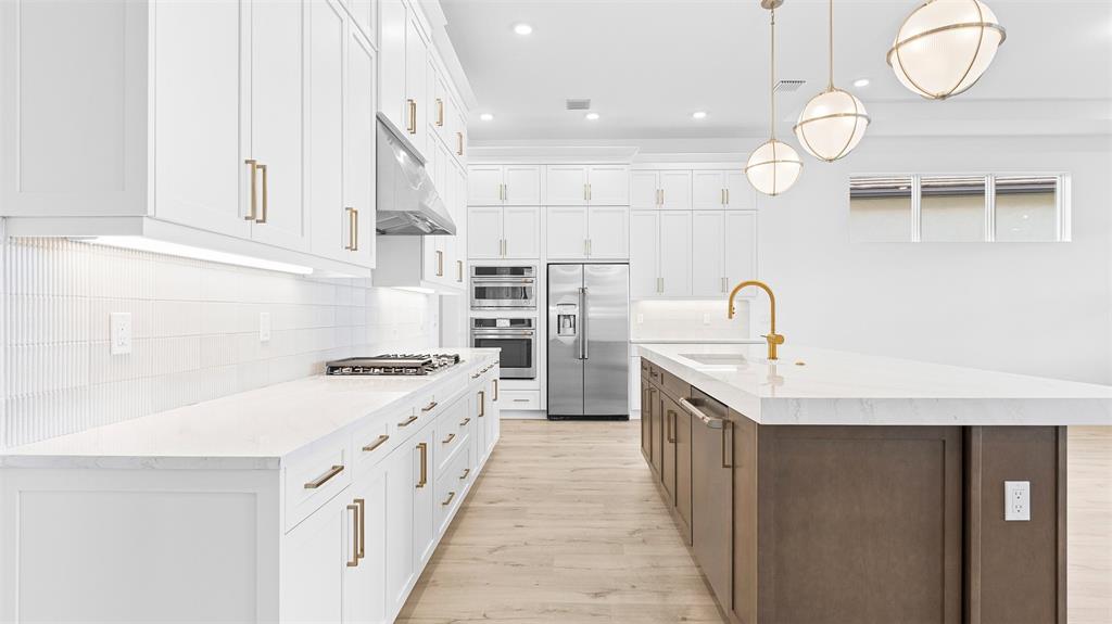 5237 Rivo Alto Circle Westlake, FL 33470 - Photo 11 of 63 a kitchen with cabinets and wooden floor