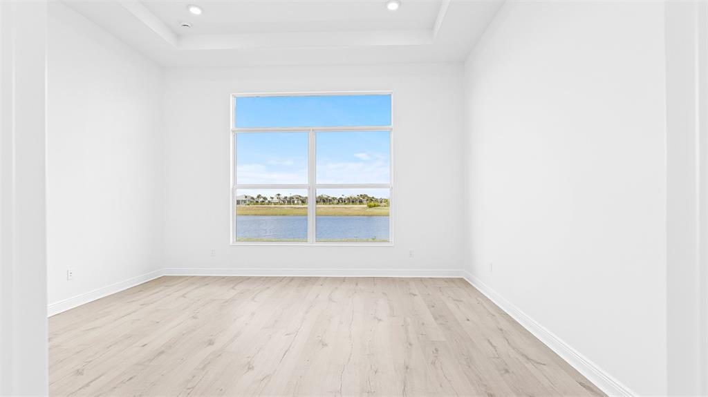 5237 Rivo Alto Circle Westlake, FL 33470 - Photo 19 of 63 a view of a small space with wooden floor and a window