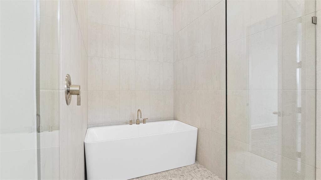5237 Rivo Alto Circle Westlake, FL 33470 - Photo 23 of 63 a white bath tub sitting next to a white sink