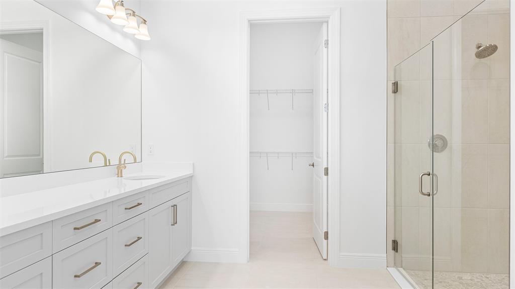 5237 Rivo Alto Circle Westlake, FL 33470 - Photo 24 of 63 a spacious bathroom with a shower and a sink