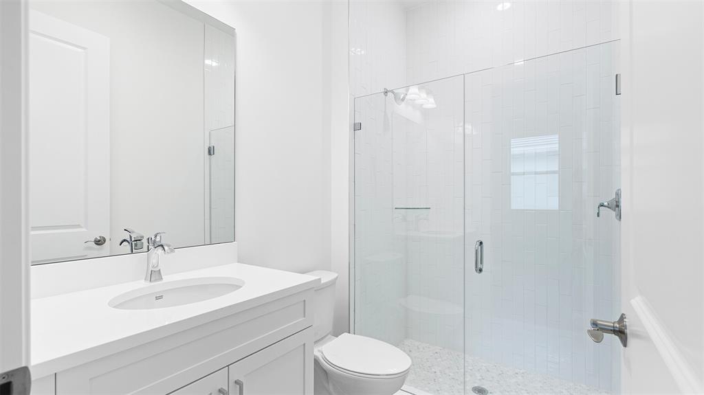 5237 Rivo Alto Circle Westlake, FL 33470 - Photo 30 of 63 a bathroom with a sink toilet and shower