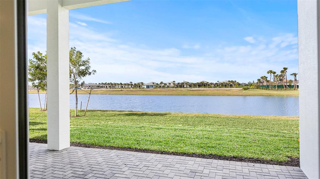 5237 Rivo Alto Circle Westlake, FL 33470 - Photo 38 of 63 a view of a lake with a big yard