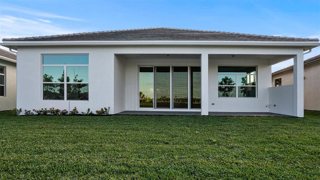 5237 Rivo Alto Circle Westlake, FL 33470 - Photo 42 of 63 a view of a front of a house with a yard