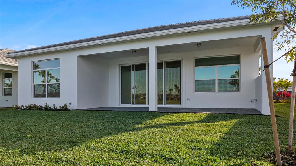 5237 Rivo Alto Circle Westlake, FL 33470 - Photo 43 of 63 front view of a house with a yard