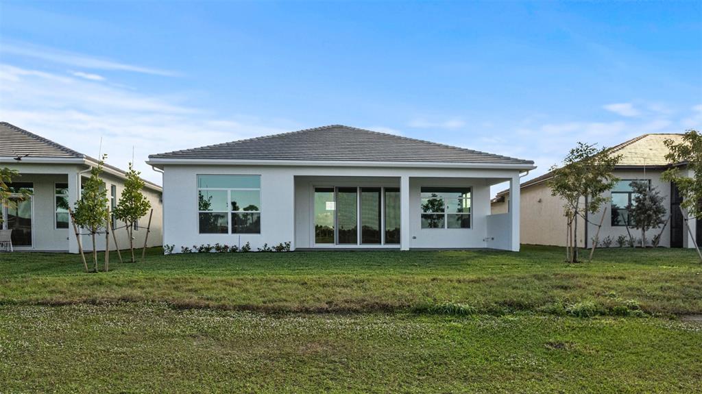 5237 Rivo Alto Circle Westlake, FL 33470 - Photo 44 of 63 a view of a house with a yard