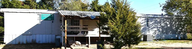 a view of a house with a tree