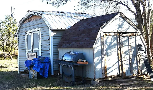 a backyard of a house with outdoor seating