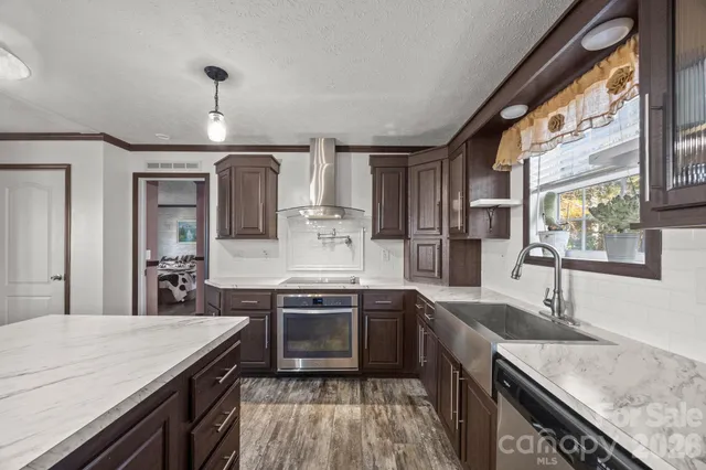 a kitchen with a stove and a sink