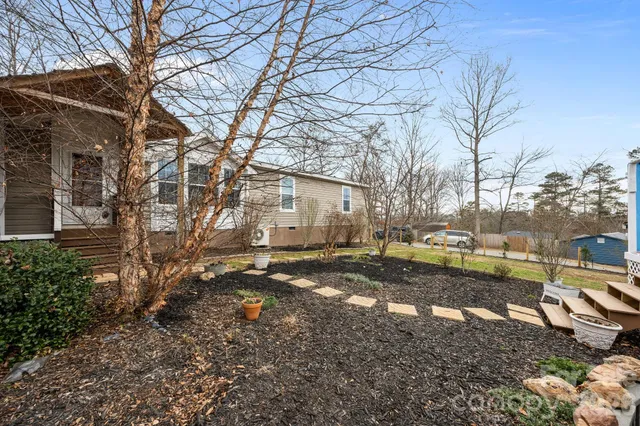 a view of a yard with snow on the road