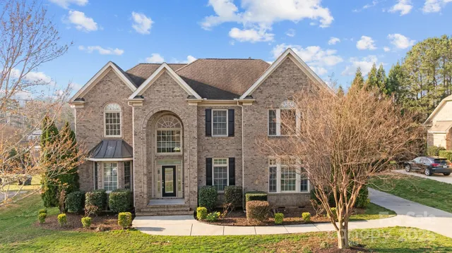 front view of a house with a yard
