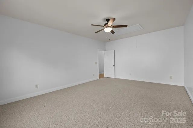 an empty room with fan
