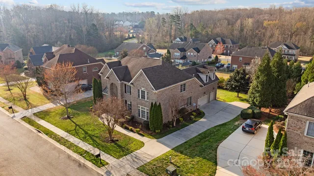 an aerial view of a house with a garden
