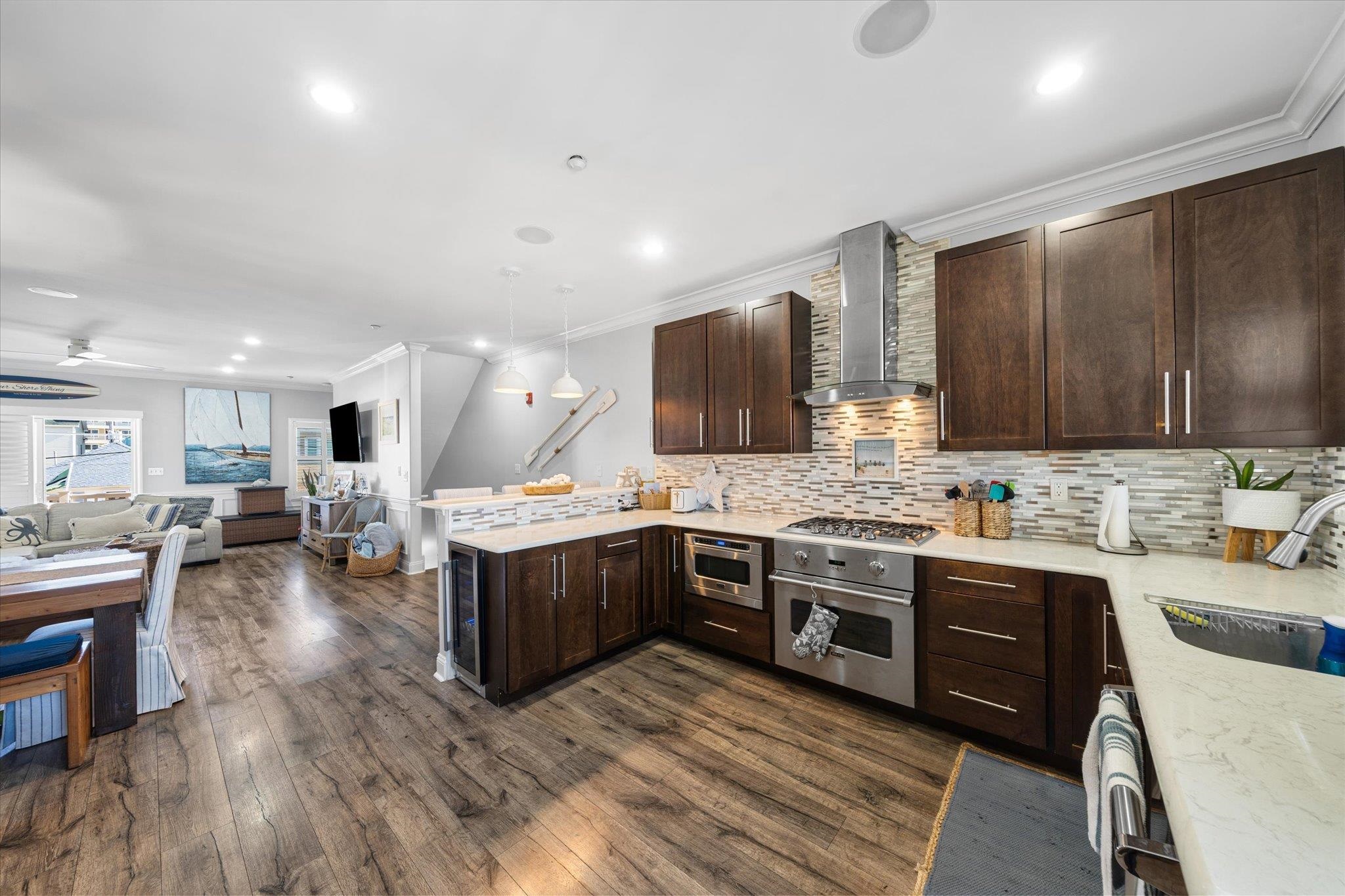 110 West Walnut Avenue, Unit 103 North Wildwood, NJ 08260 - Photo 11 of 44 a kitchen with lots of counter top space and stainless steel appliances