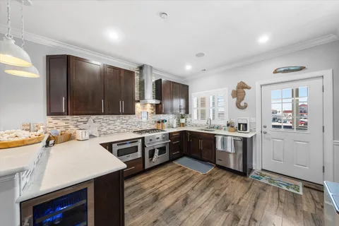 a kitchen with a sink stove and cabinets