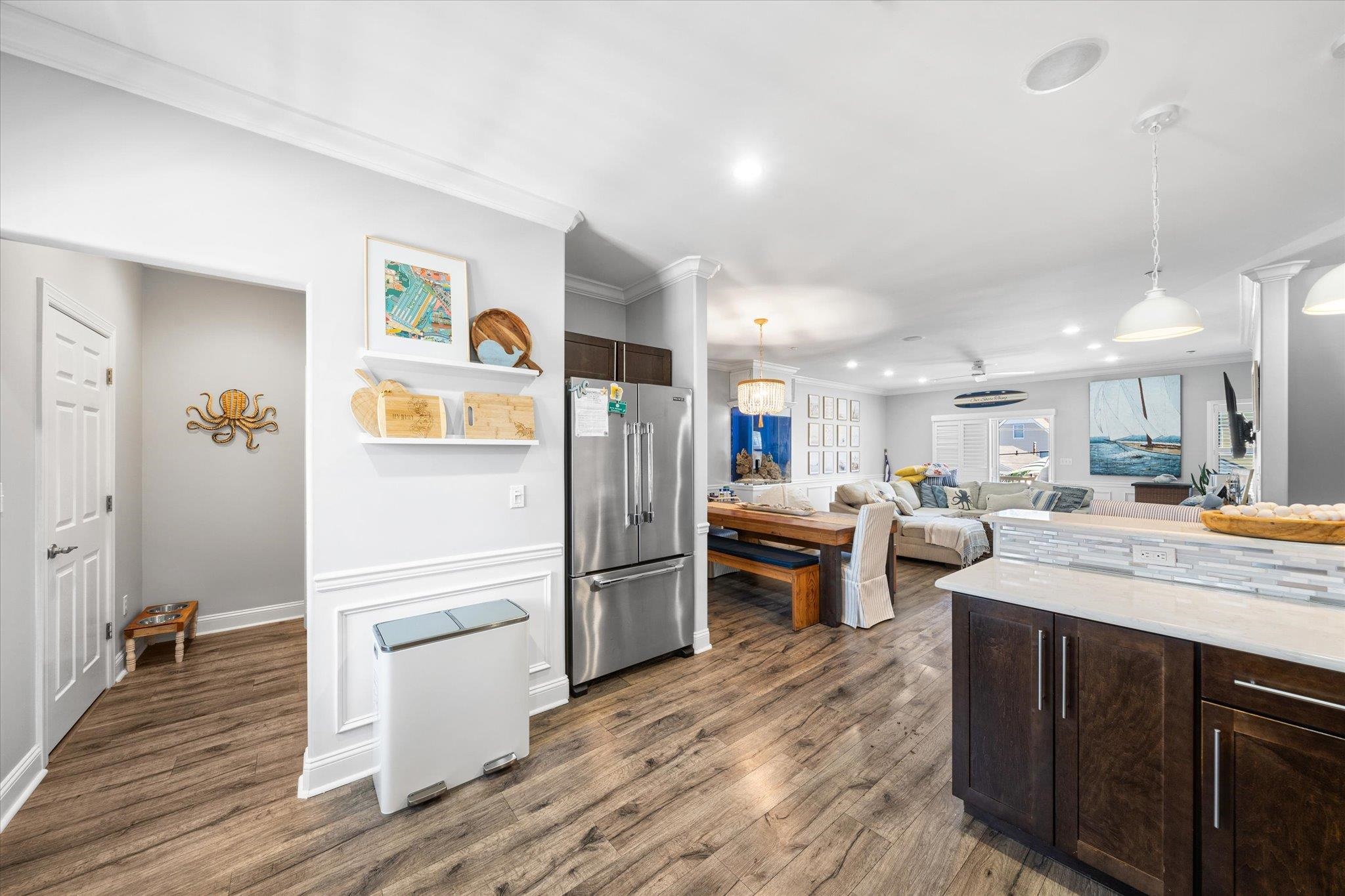 110 West Walnut Avenue, Unit 103 North Wildwood, NJ 08260 - Photo 13 of 44 a kitchen with stainless steel appliances kitchen island granite countertop a refrigerator and a stove top oven