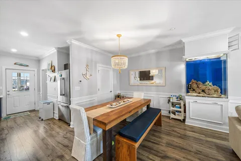 a very nice looking living room with wooden floor and furniture