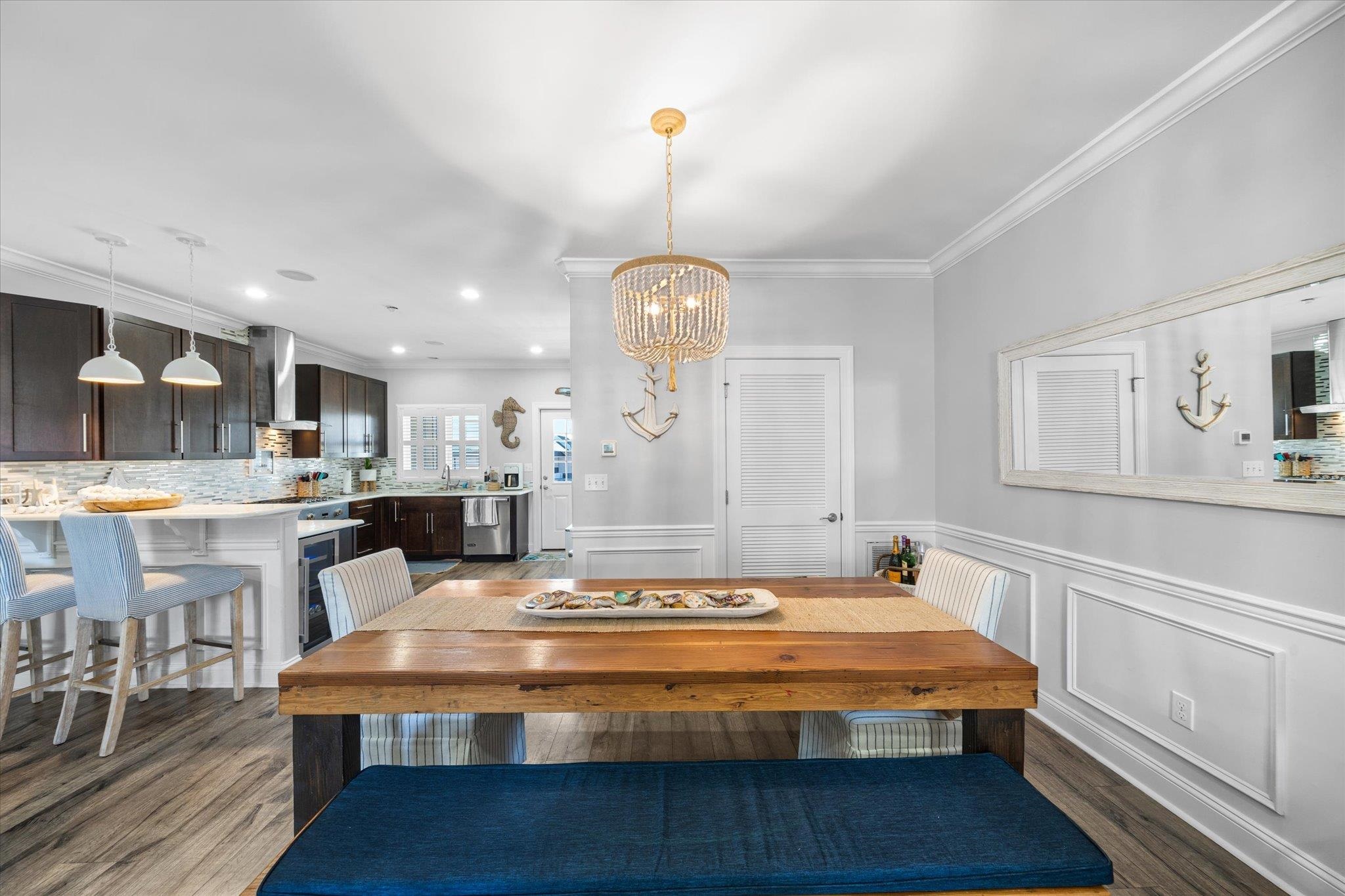 110 West Walnut Avenue, Unit 103 North Wildwood, NJ 08260 - Photo 16 of 44 a room with kitchen island granite countertop furniture and a chandelier