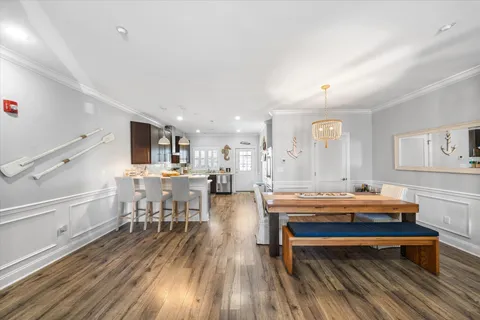 a outdoor space with lots of furniture a sink and stainless steel appliances